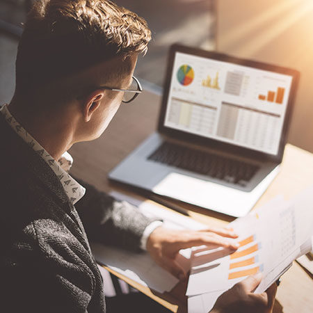man looking at analytics on screen